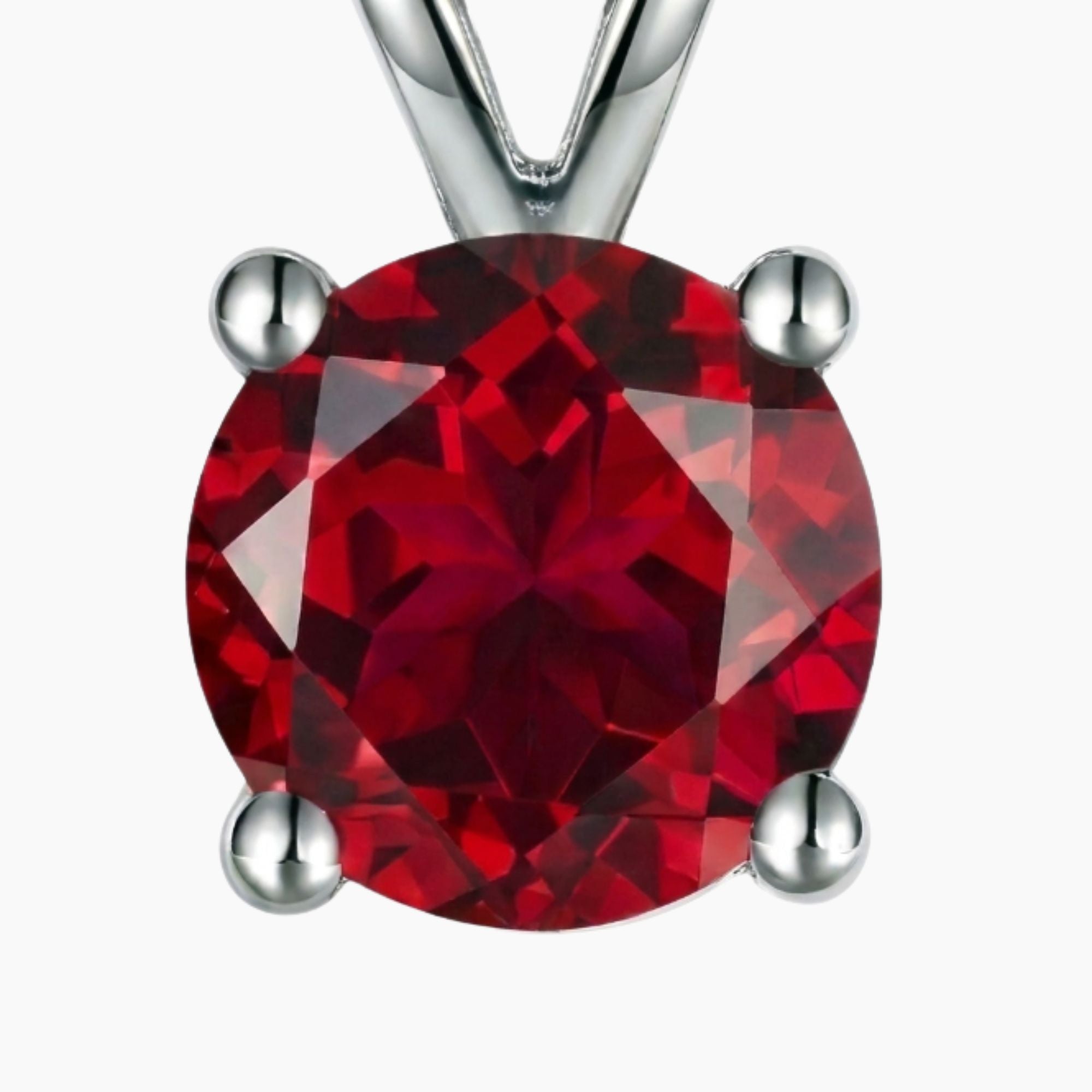 macro shot of round v bale ruby pendant