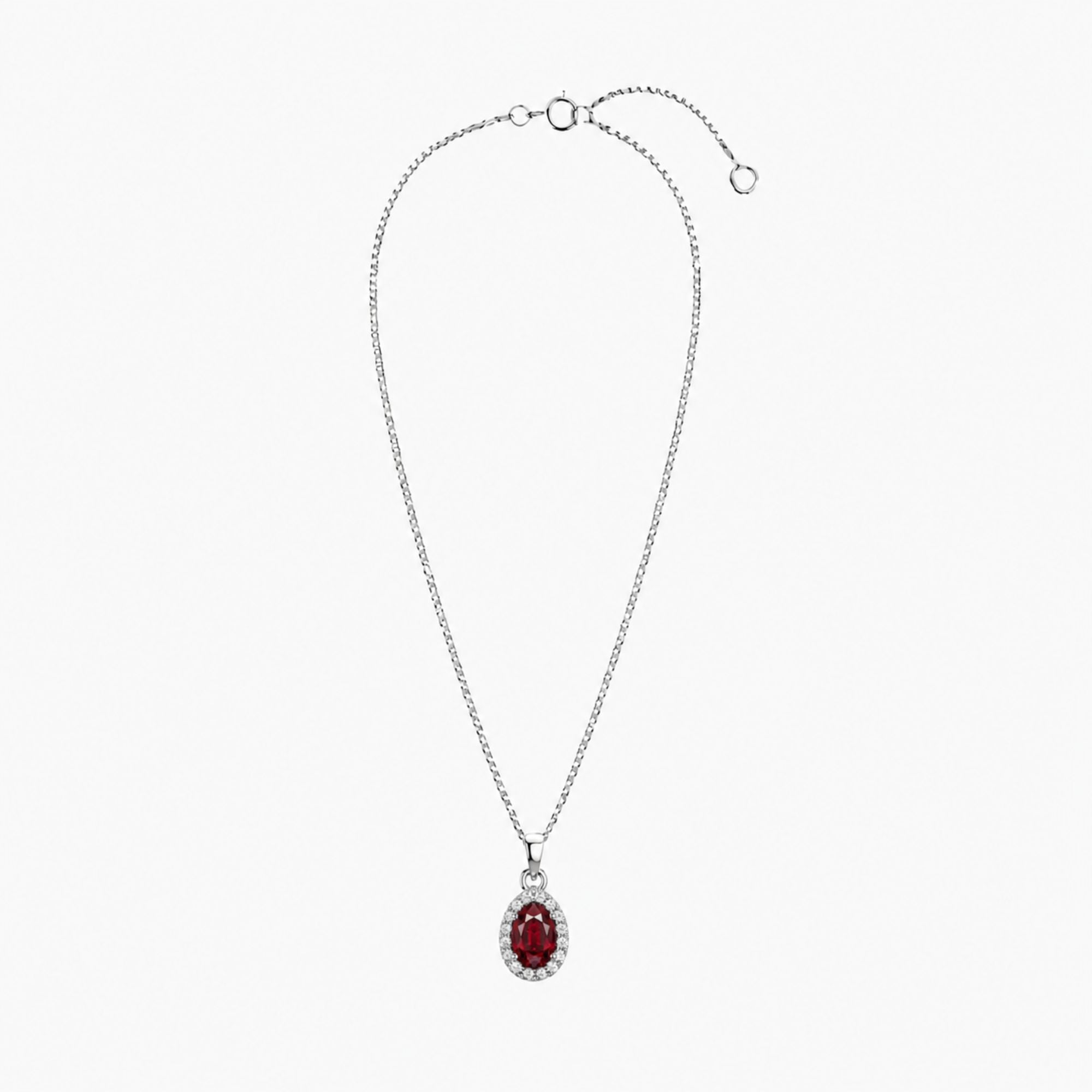 Silver necklace with a red gemstone ruby pendant on a white background