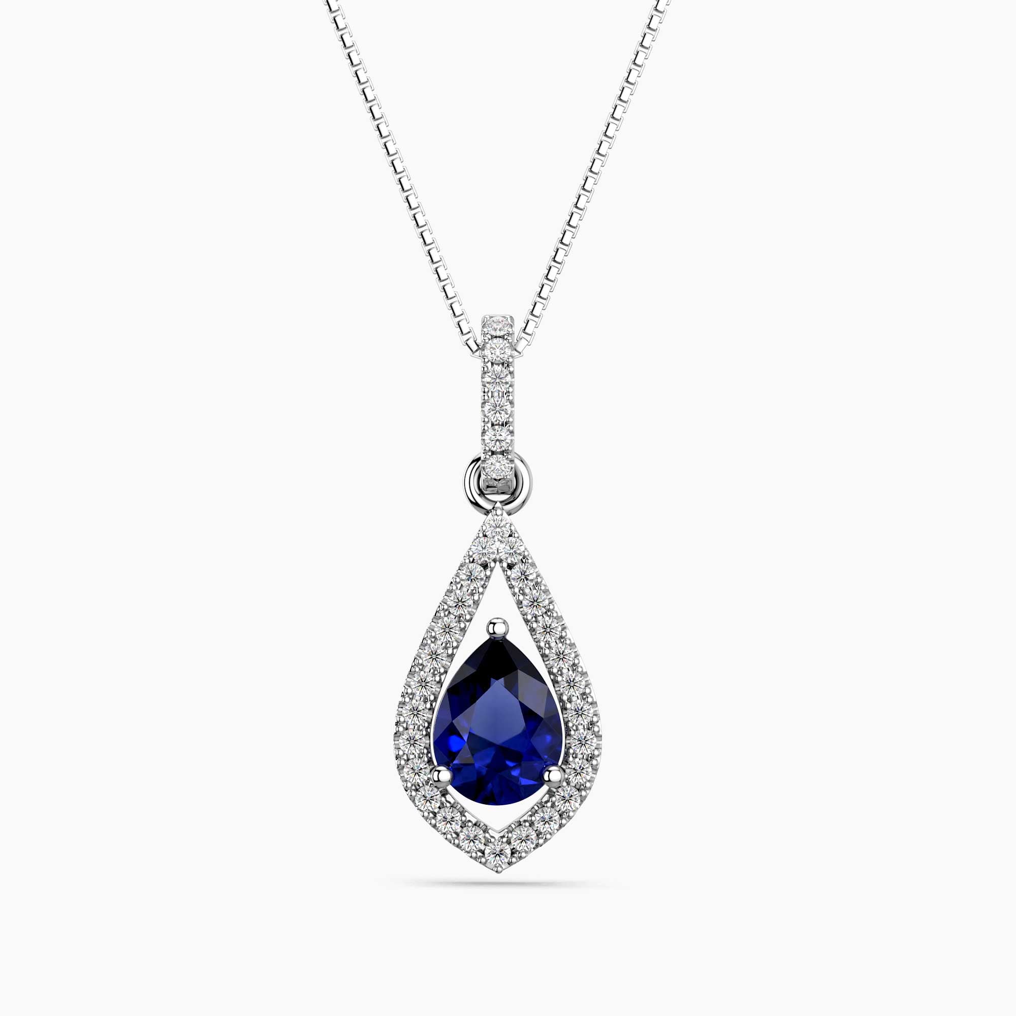 Teardrop-shaped pendant with blue sapphire gemstone and diamond accents on a white background