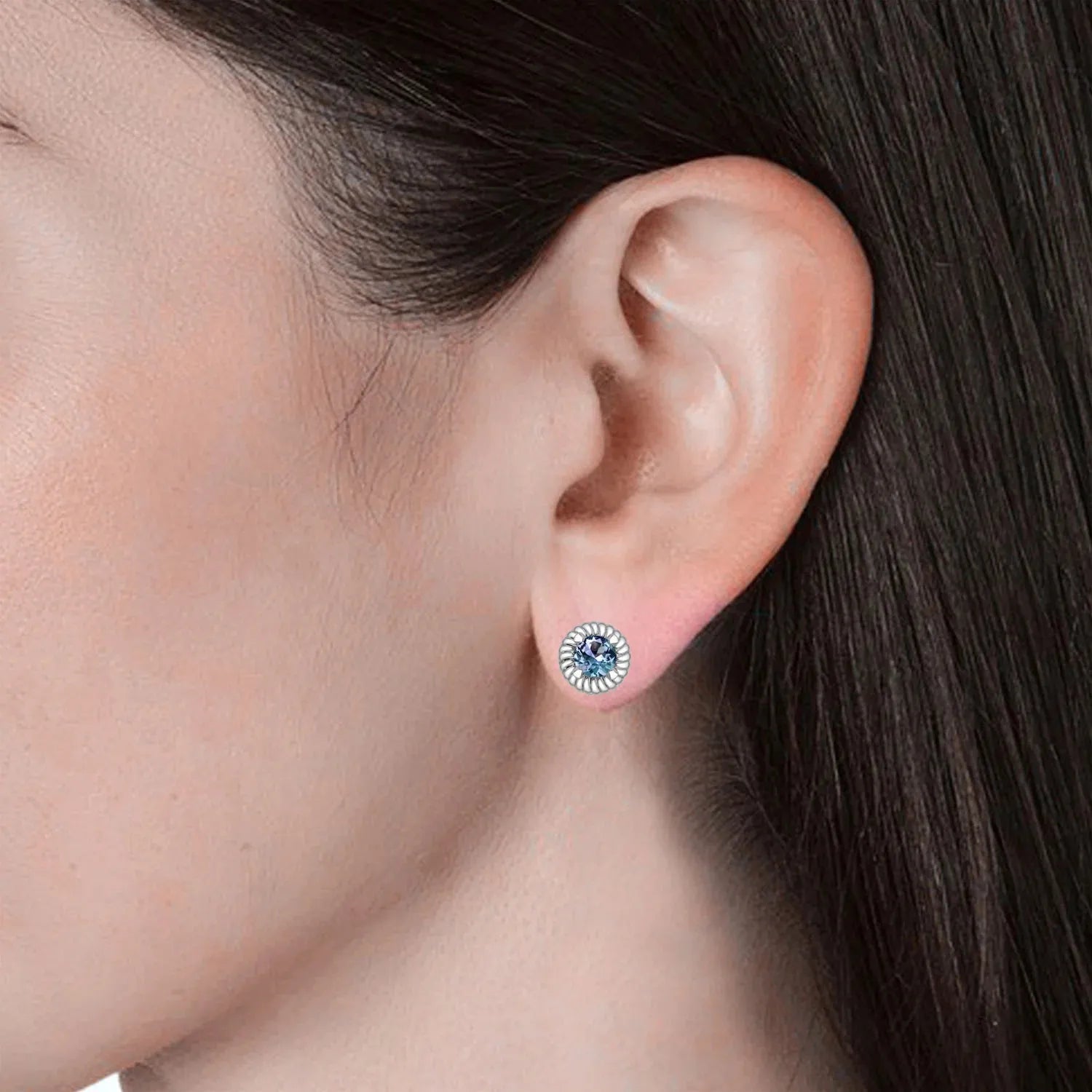 model showcasing alexandrite stud earrings