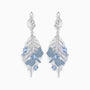 Silver feather-shaped dragonfly topaz earrings with blue gemstones on a white background