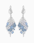 Silver feather-shaped dragonfly topaz earrings with blue gemstones on a white background