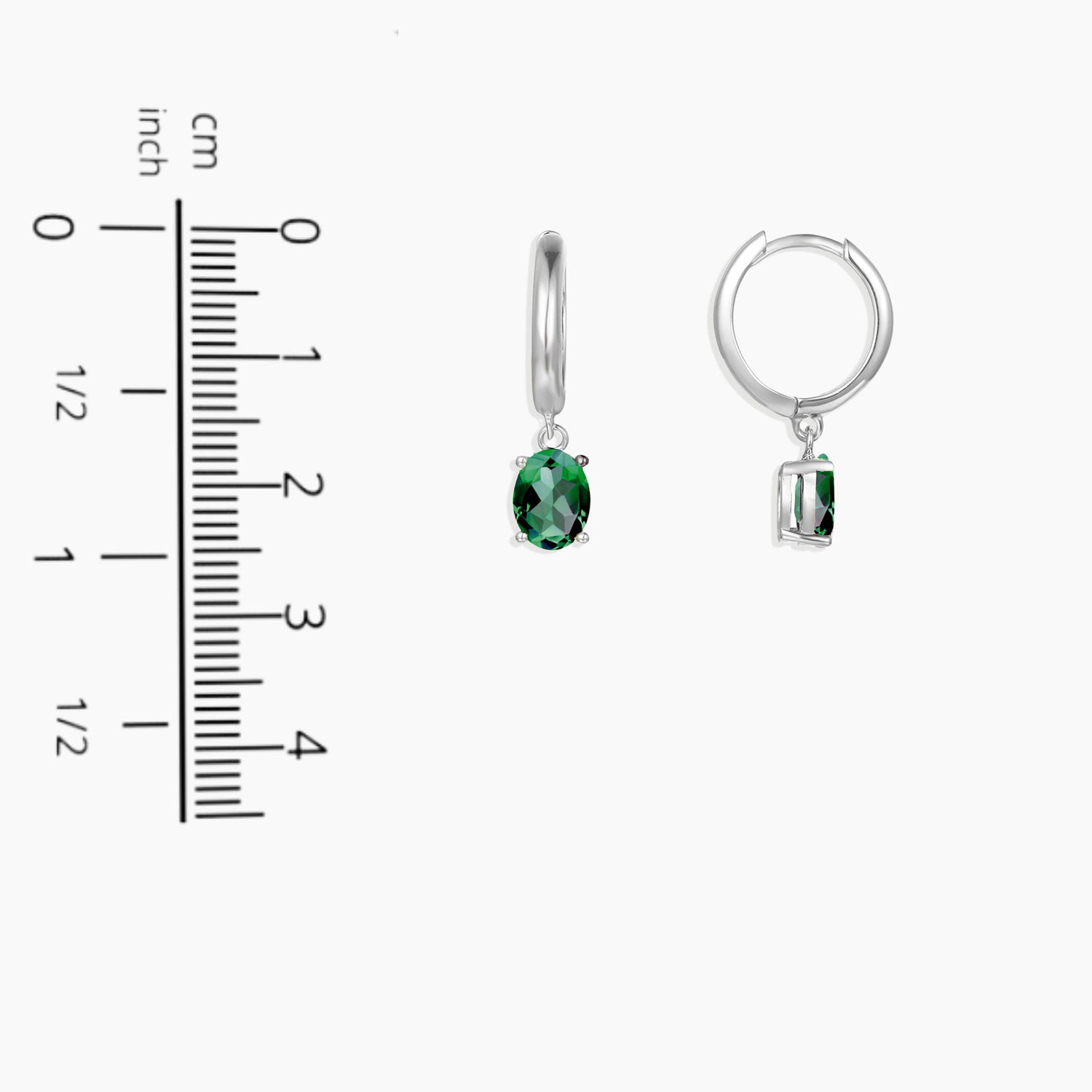 Silver emerald Olivia dangling earrings next to scale for size comparison