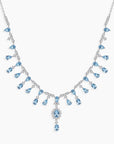Necklace with blue teardrop-shaped stones on a white background