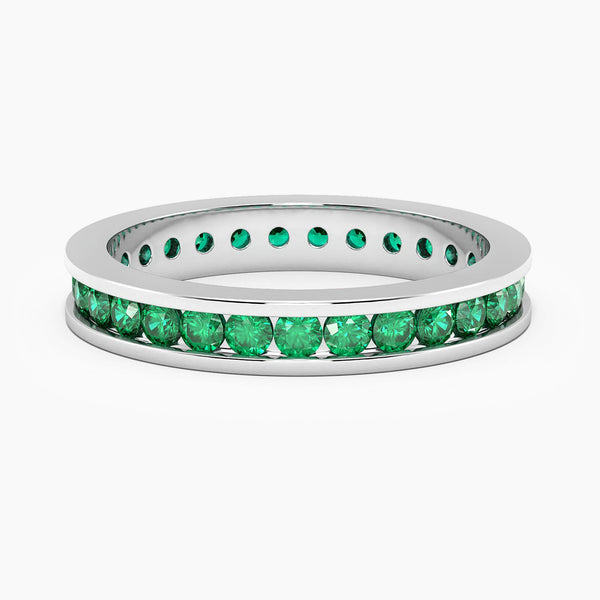 front view of emerald channel set ring