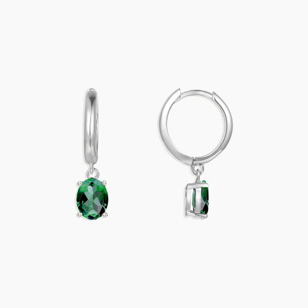Front view of silver emerald Olivia dangling earrings