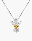 Silver angel pendant with a yellow citrine heart-shaped gem on a white background