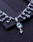 Necklace with blue topaz gemstones on a dark surface