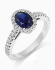Sterling silver sapphire halo ring with CZ accents