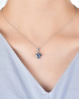 Alexandrite moon necklace worn on model – elegant silver jewellery with colour-changing gemstone