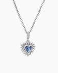 Back side Close-up of heart-cut Alexandrite pendant necklace with halo setting and white gold look