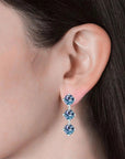 Alexandrite triple gemstone stud earrings worn on ear – elegant June birthstone jewellery for women