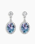 Front view of Alexandrite drop earrings with 7x9 mm oval gemstone and polished silver finish