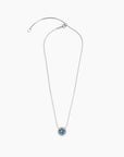 Alexandrite halo necklace laid flat with adjustable trace chain and lobster clasp
