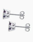Alexandrite hexagon studs showing butterfly backing and clean geometric silver setting