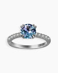 Alexandrite solitaire ring with pavé band in sterling silver – round-cut gemstone shifts blue to purple