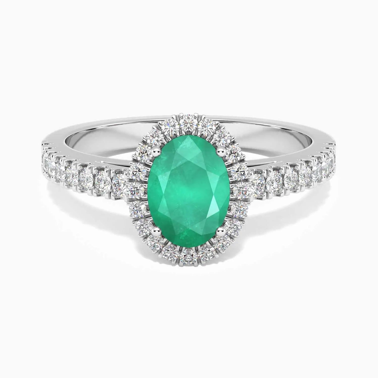 Sterling silver oval-cut emerald halo ring with a 5 × 7 mm natural Sakota emerald surrounded by sparkling CZ.