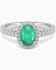 Sterling silver oval-cut emerald halo ring with a 5 × 7 mm natural Sakota emerald surrounded by sparkling CZ.