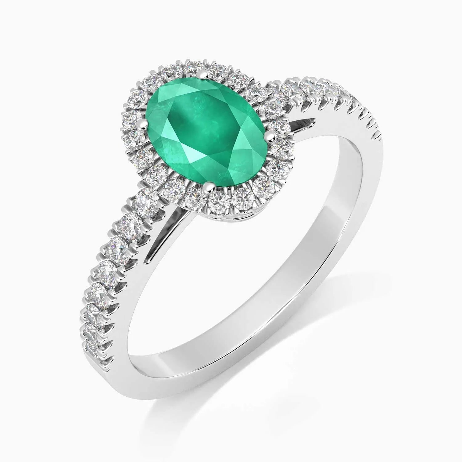 Angled view of the sterling silver emerald halo ring, showing the 4-claw setting and shimmering CZ accents.