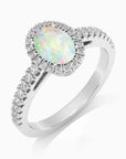 side view of oval white opal ring in silver