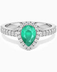 Sterling silver pear-cut emerald halo ring with a natural Sakota emerald center stone, framed by sparkling CZ.