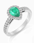 Angled view of the pear-cut emerald halo ring in rhodium-plated sterling silver, featuring a 5×7 mm center stone and a CZ halo.