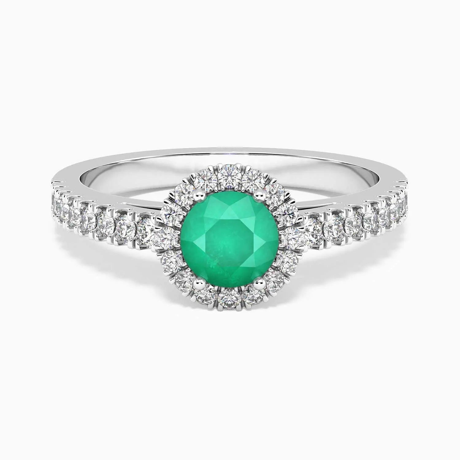 Sterling silver round-cut emerald halo ring with a natural Sakota emerald center stone surrounded by CZ.