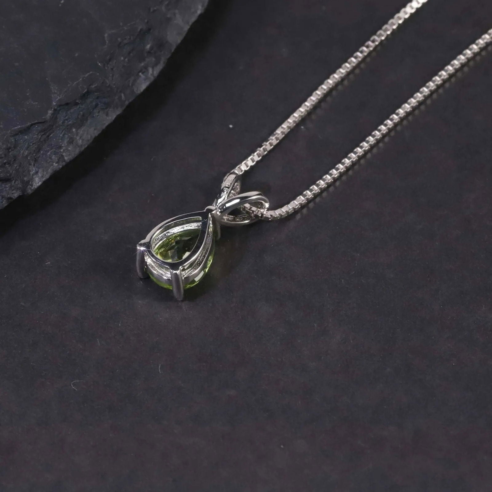Close-up of Sterling Silver Peridot Necklace on Model – Pear-Shaped Pendan