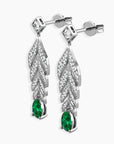 Angled shot highlighting the intricate feather design and pear-shaped emerald drops.