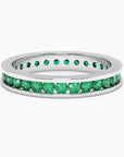 Sterling silver channel-set ring featuring vibrant lab-created emeralds.