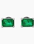 Top-down perspective displaying the emerald-cut emerald studs with butterfly back closures.