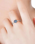 Alexandrite trilogy ring on hand – symbolic three-stone jewellery gift for women born in June