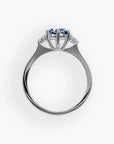 Profile view of Alexandrite trilogy ring showing prong setting and side detailing in sterling silver