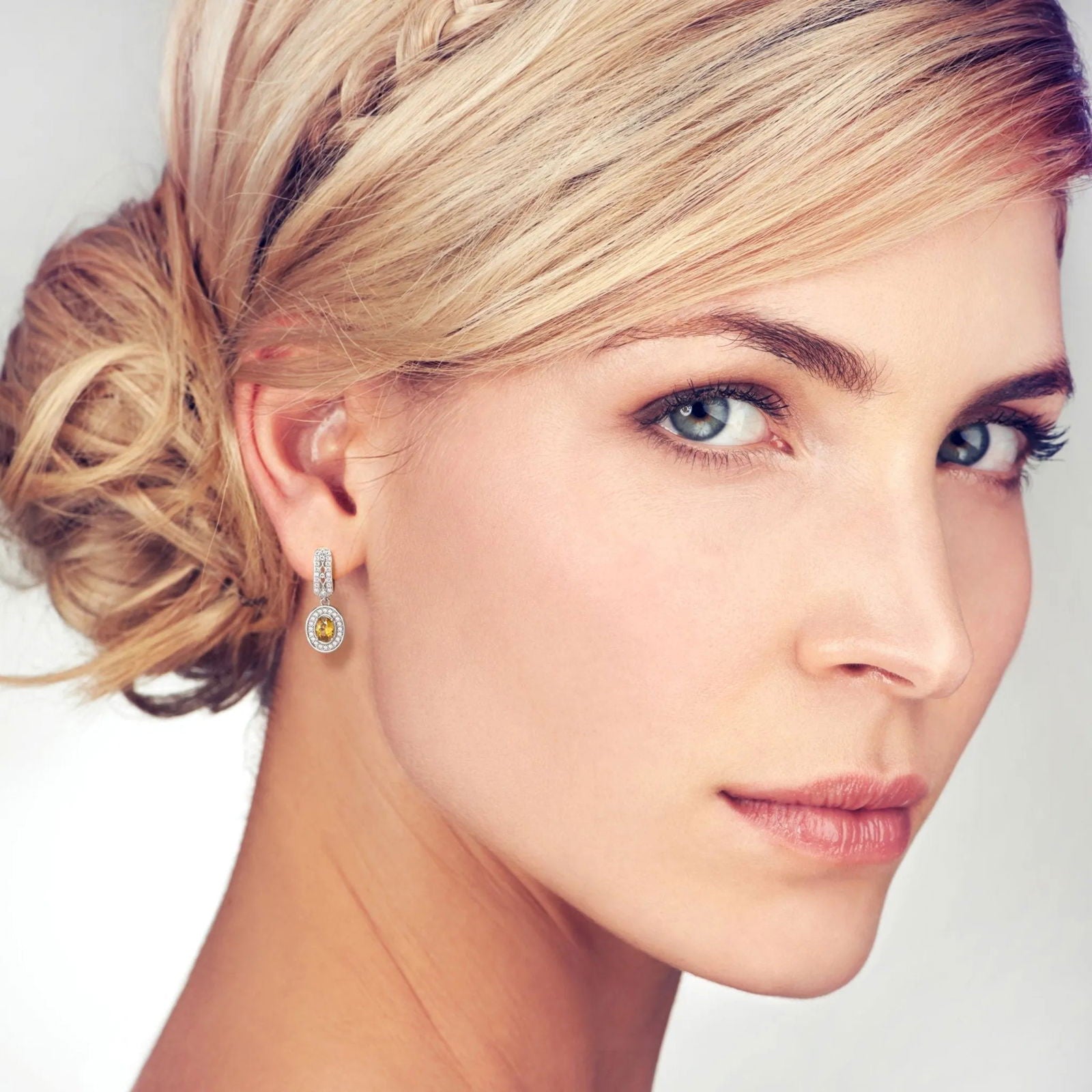 Exquisite Design: Designer Oval Citrine Drop Earrings on a model
