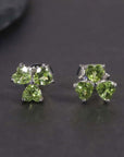 Close-up of Peridot Silver Stud Earrings – Flower Shape with Heart-Cut Gemstones