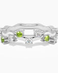 Sterling silver galaxy gleam design ring with natural green peridot and white zirconia accents.