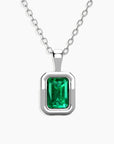 back-facing view of the emerald-cut emerald pendant on a sterling silver chain.