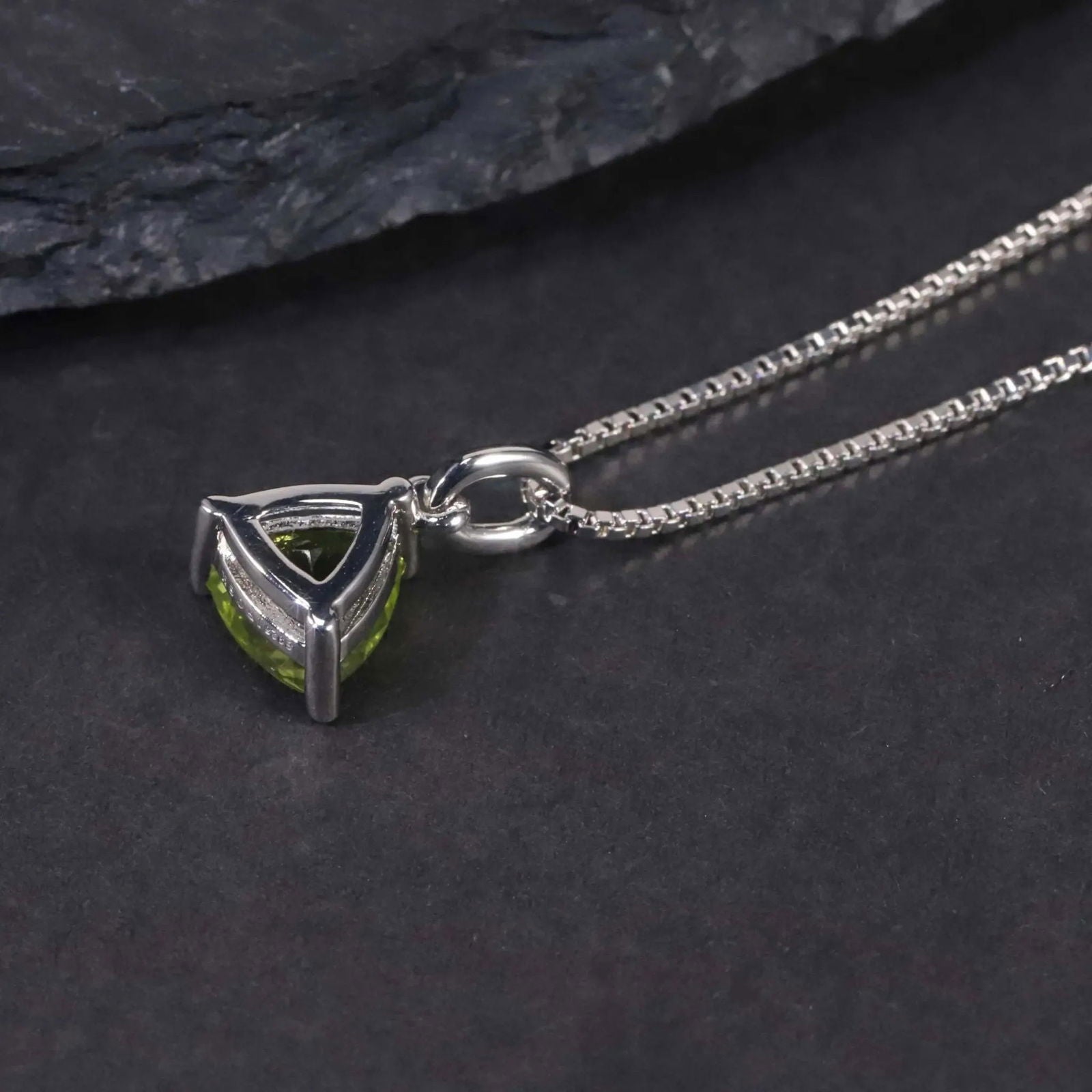 back side of trllion cut pendant with peridot