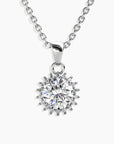 Moissanite 1ct Sunburst Pendant Necklace in sterling silver, displayed against a white background.