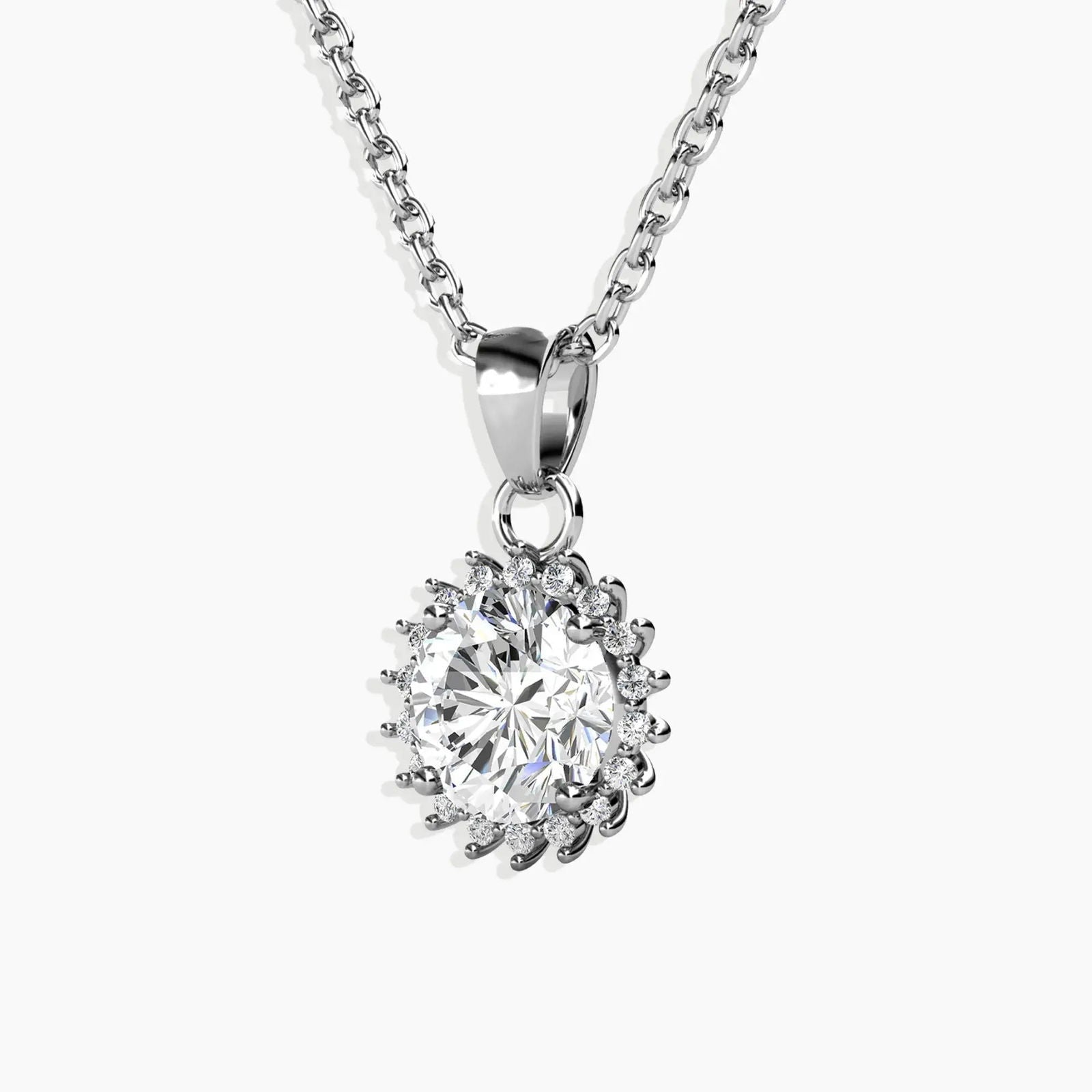 Detailed close-up of the sunburst pendant, highlighting the round moissanite center and rhodium-plated silver rays.