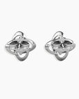 Alternate-angle shot of the Moissanite bond Stud Earrings, showcasing their three-dimensional design and rhodium-plated sterling silver finish.