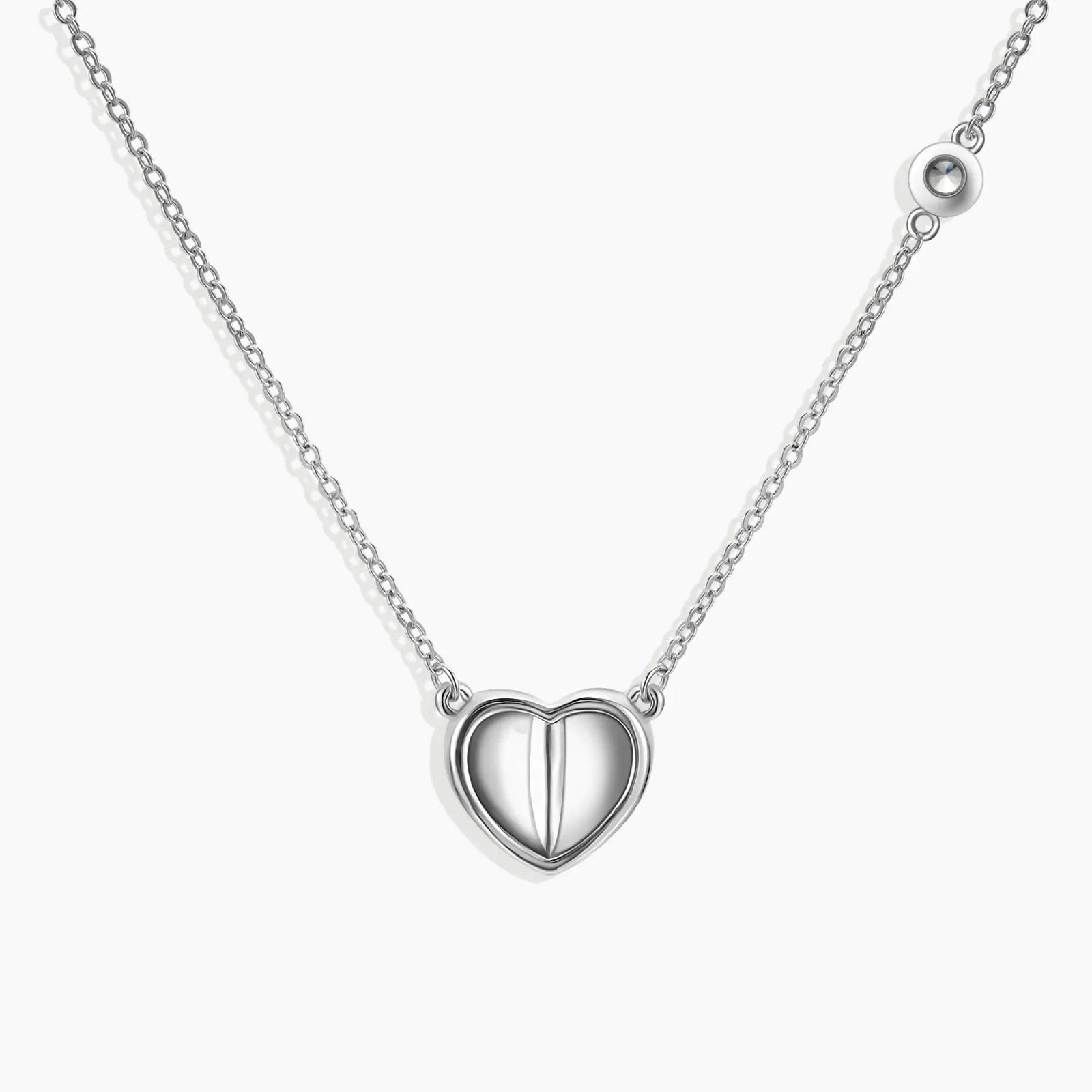 Alternate angle of the Heart Pendant Necklace, highlighting its sterling silver heart setting and moissanite sparkle.”

