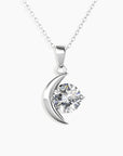 Moissanite Crescent Moon Pendant Necklace in sterling silver, featuring a 1ct round moissanite stone against a white background.