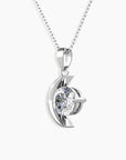 Front view of the Moissanite Crescent Moon Pendant, highlighting the 6.5 mm center stone and polished silver crescent shape.