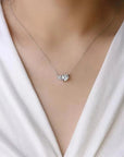 Model wearing the Moissanite Twin Pendant Necklace, showcasing its elegant twin-stone design and sparkling moissanite gems.