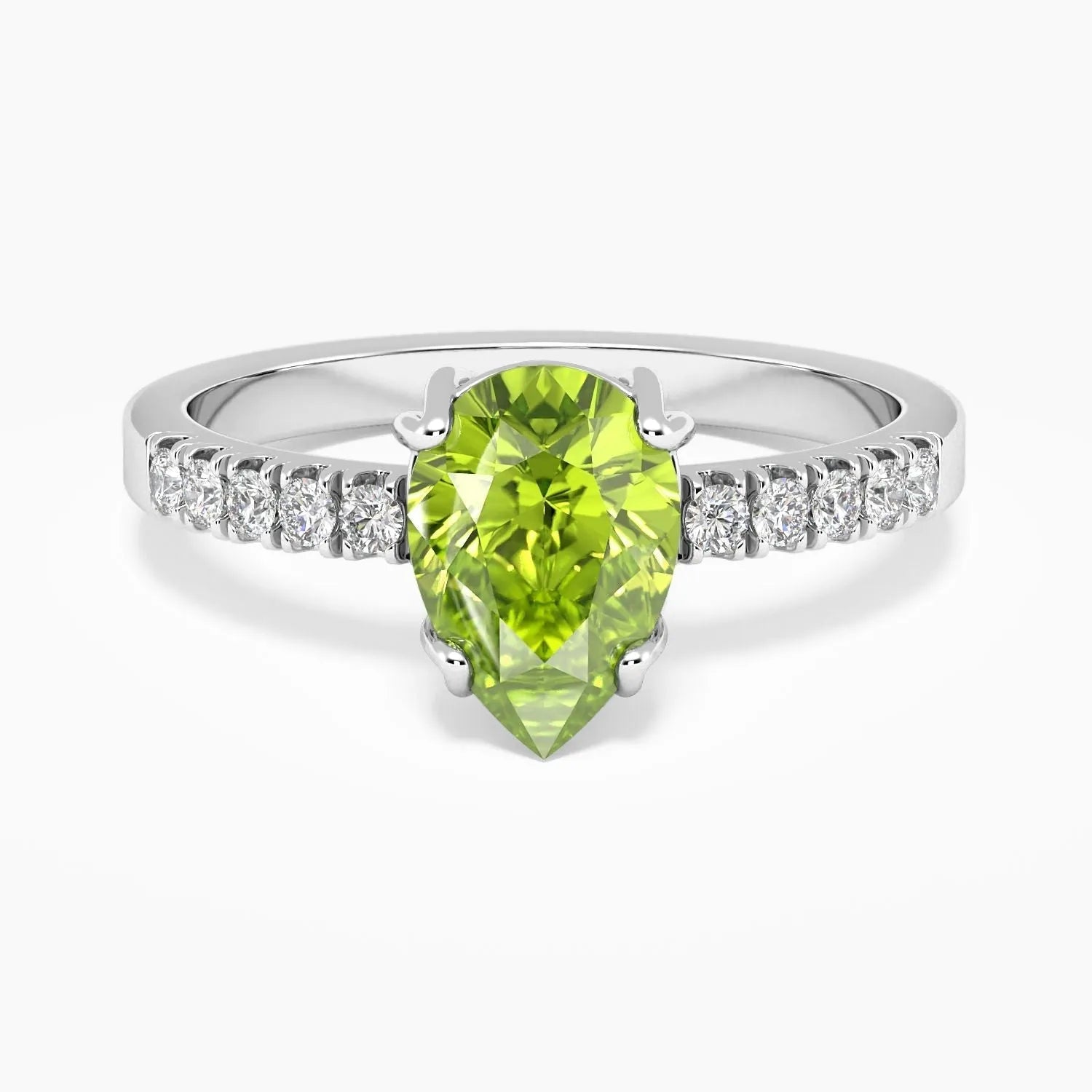 Pear Cut Peridot Ring in Sterling Silver, featuring a vibrant pear-shaped peridot gemstone in a classic halo design.