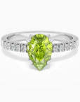 Pear Cut Peridot Ring in Sterling Silver, featuring a vibrant pear-shaped peridot gemstone in a classic halo design.