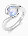 Top view of the Irosk moonstone ring with a luminous round-cut gemstone and polished wave-inspired band