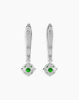 Side-by-side or angled view of the emerald drop hoop earrings on a dark background.