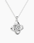 Rear side shot of the Bond Pendant Necklace, highlighting the openwork silver design and rhodium-plated finish